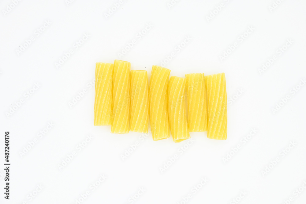 Raw Tortiglioni pasta, isolated on a white background