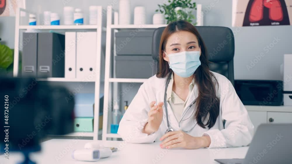 Asian medical woman doctor record video online for patient in hospital Asian medical woman doctor record video online for patient in hospital