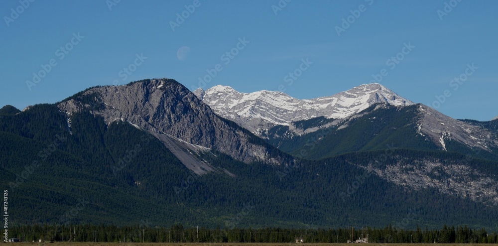 View of the mountains with moon in a background