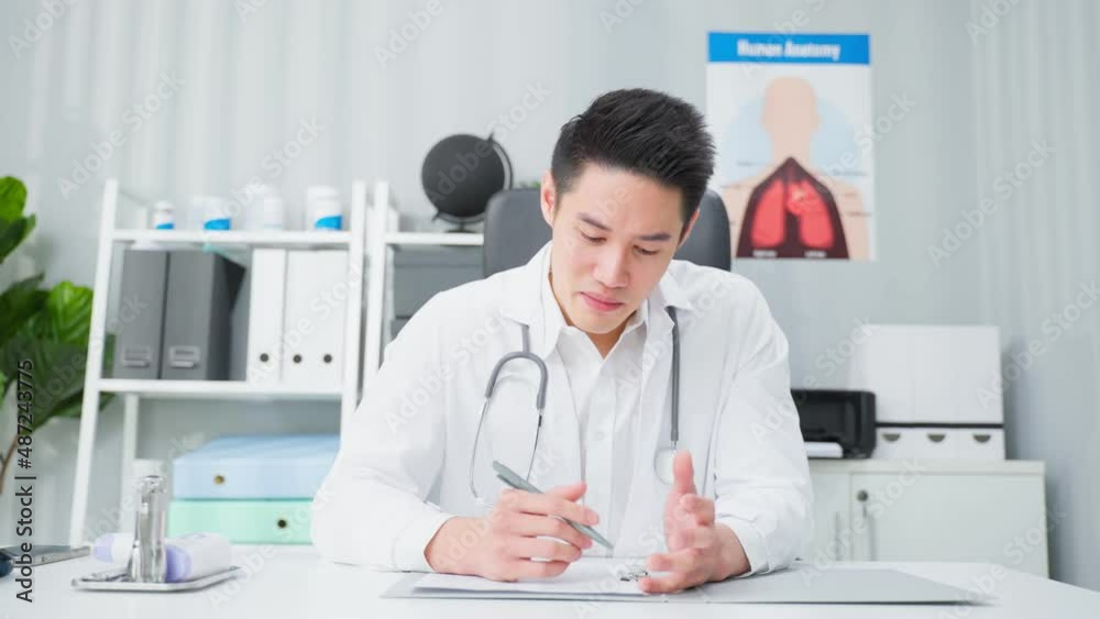 Asian male medical doctor talking virtual online with patient at home. Asian male medical doctor talking virtual online with patient at home.