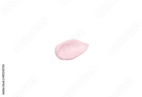 Smear of pink cosmetic cream isolated on white background close-up.