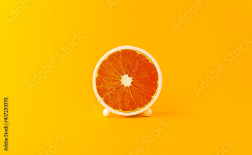 Creative and innovative ideas with circle oranges like time. Artistic concepts and mixing ideas image of orange imagination