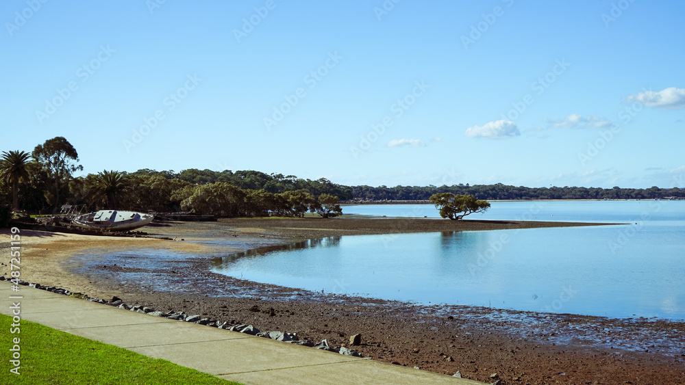 Tranquil scene looking across the water from Victoria Point to Coochiemudlo Island  at low tide. Queensland, Australia 