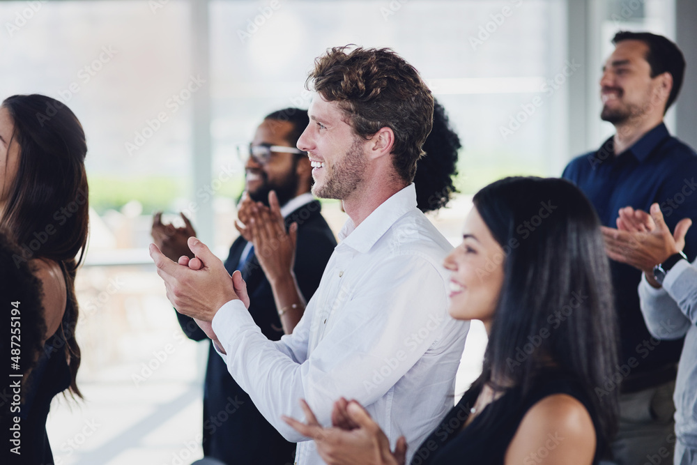 That talk is deserving of a standing ovation. Cropped shot of a group of businesspeople applauding during a seminar in the conference room. That talk is deserving of a standing ovation. Cropped shot of a group of businesspeople applauding during a seminar in the conference room.