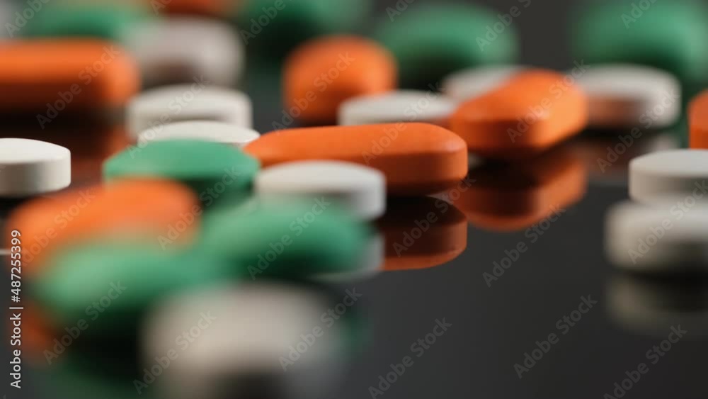 Slow Motion Shot of rotation Colorful Pills on black Background. 4K Slow Motion Shot of rotation Colorful Pills on black Background. 4K