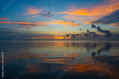 Beautiful sunset over the sea water on the island of Koh Phangan  Thailand. Travel and nature concept