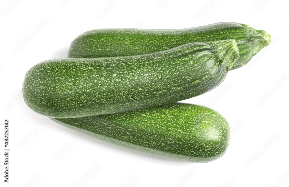 Raw ripe zucchinis on white background, top view Raw ripe zucchinis on white background, top view