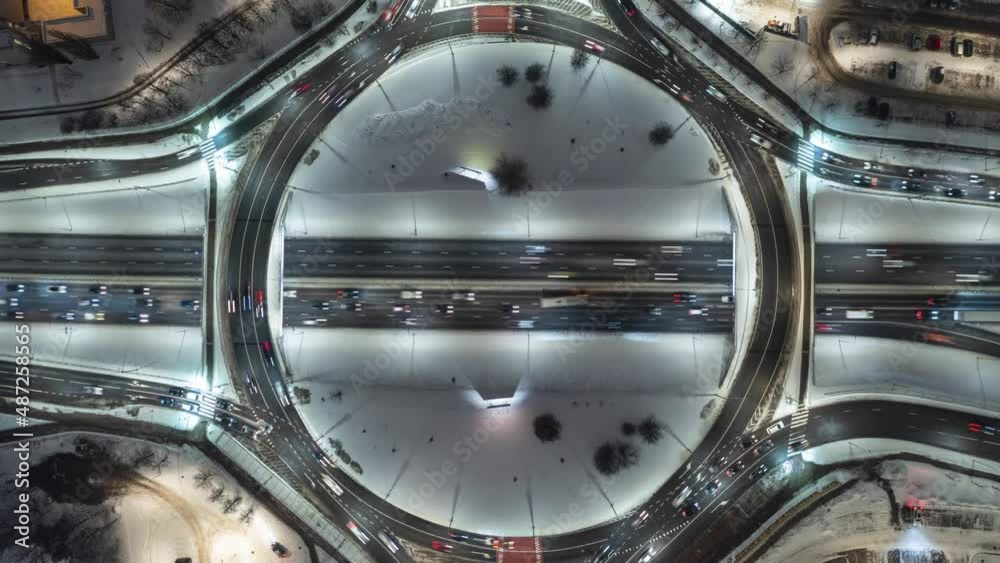 Beautiful Top View Winter Hyperlapse of Car Traffic at Roundabout Lane - Urban Cityscape Concept Beautiful Top View Winter Hyperlapse of Car Traffic at Roundabout Lane - Urban Cityscape Concept