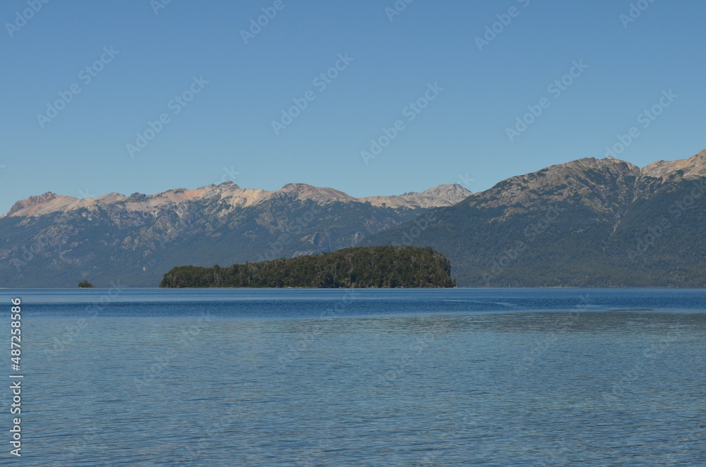 Some mountains and an island in the background of Lake Correntoso, in Argentine Patagonia