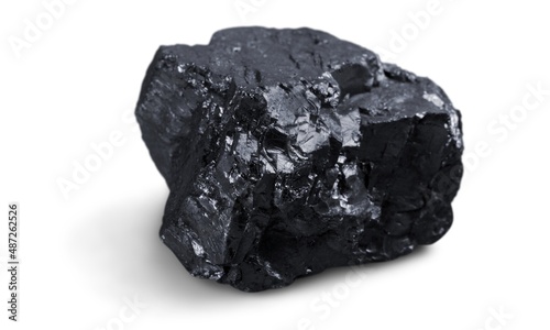 Fotografija Meteorite black stone rock on background.