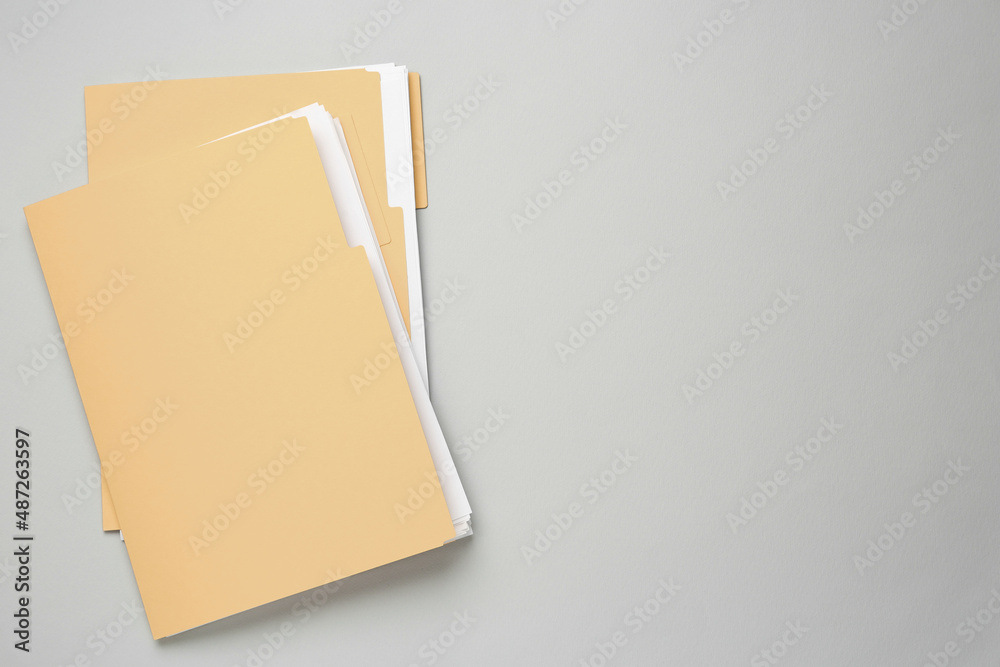 Yellow files with documents on light grey background, top view. Space for text - obrazy, fototapety, plakaty 