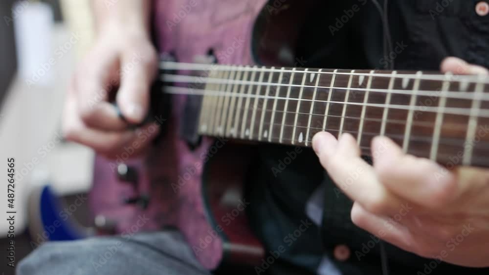 Close-up of a musician playing the guitar. Close-up of a musician playing the guitar.