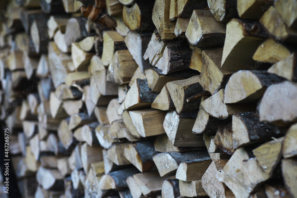 Firewood in a pallet. Chopped firewood lies on the ground. Wooden background.. Firewood in a pallet. Chopped firewood lies on the ground. Wooden background..