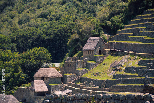 Old stone homes and terraces in the Inca City Machu Picchu photo