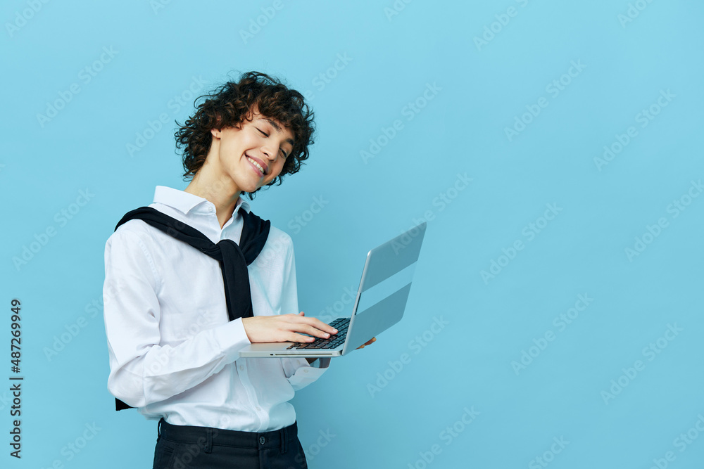 freelancer with laptop internet in a white shirt with a sweater blue background