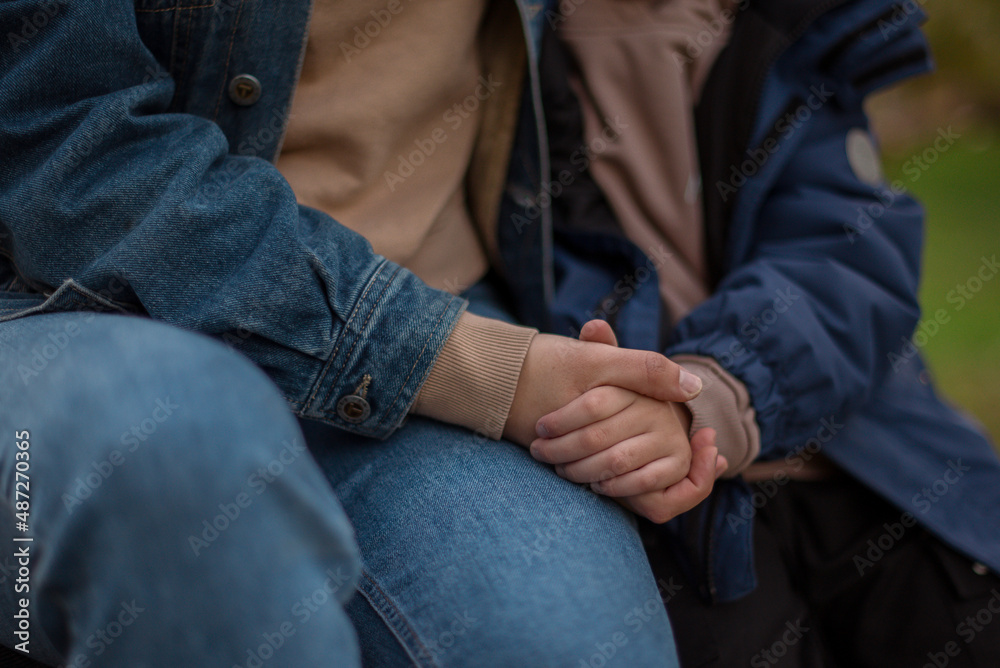 A child's hand in a mother's hand A child's hand in a mother's hand