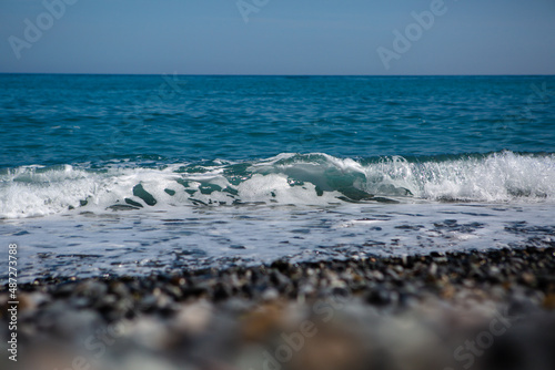 Light blue sea wave near the shore