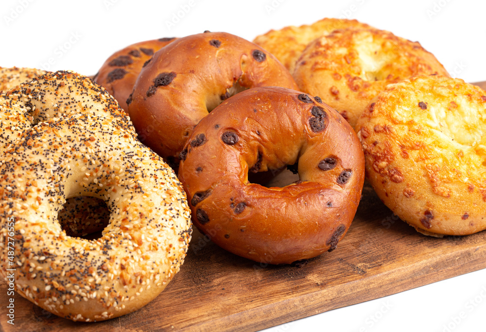 Variety of Bagel Flavors on a Cutting Board Variety of Bagel Flavors on a Cutting Board