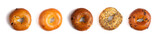 A Row of Five Different Types of Bagels Isolated on a White Background
