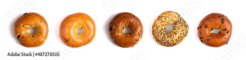 A Row of Five Different Types of Bagels Isolated on a White Background