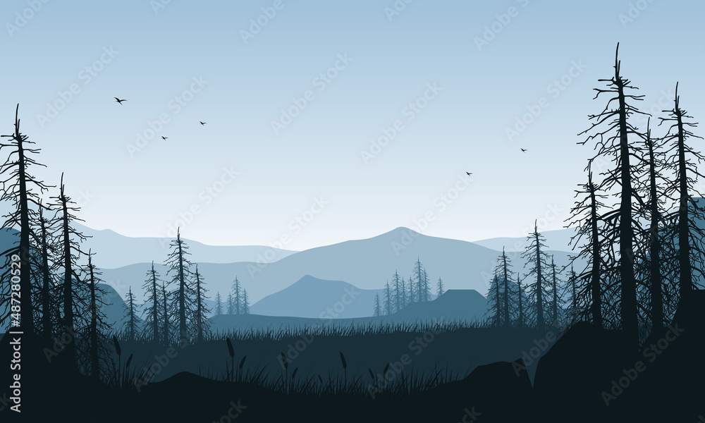 Fototapeta premium Amazing mountain view from out of the city with the blue sky and the silhouettes of dry trees around