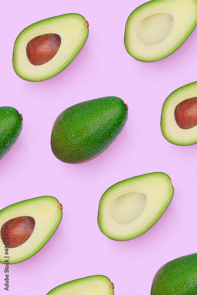 pattern set of avocado cut in half on a light pink background
pattern set of avocado cut in half on a light pink background
