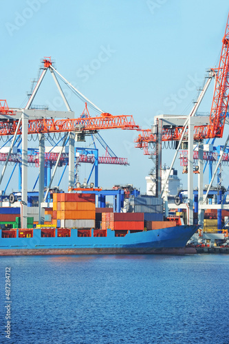 Port cargo crane, ship and container photo