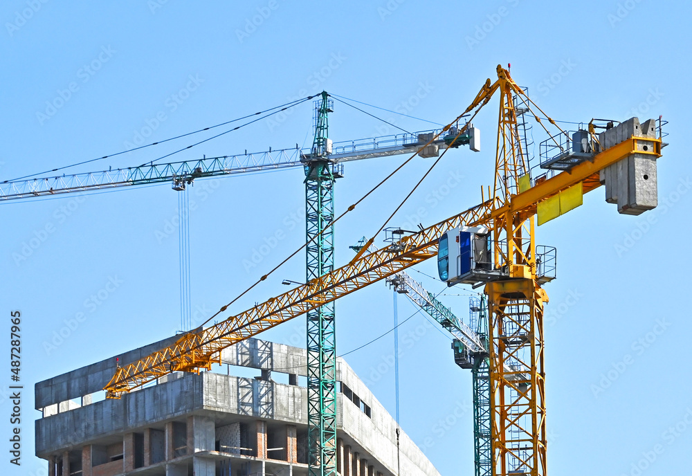 Crane and highrise construction site