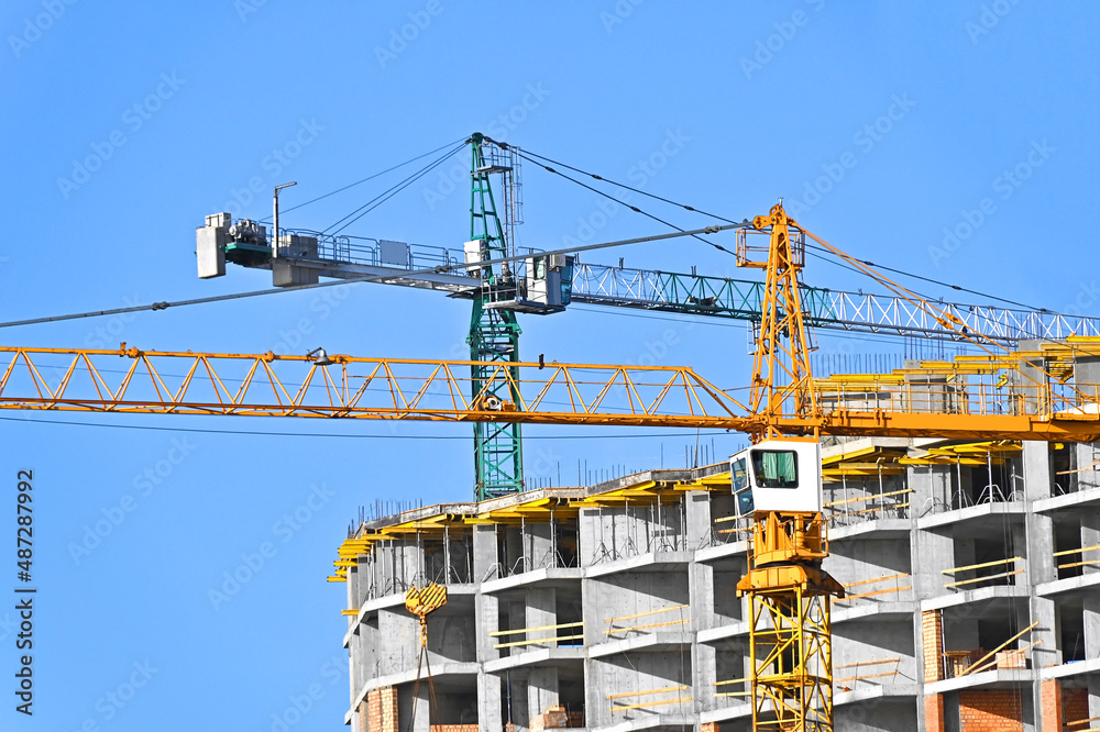 Crane and highrise construction site Crane and highrise construction site