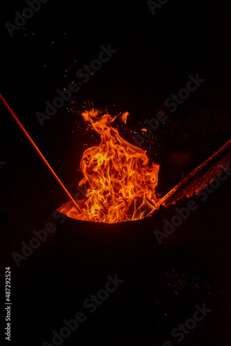 fire burning in an outdoor fireplace
