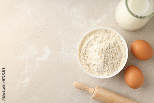 Ingredients for pie or cake cooking on light textured table