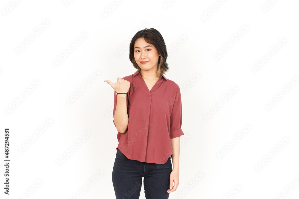 Showing and Pointing Product With Thumb Of Beautiful Asian Woman Isolated On White Background Showing and Pointing Product With Thumb Of Beautiful Asian Woman Isolated On White Background