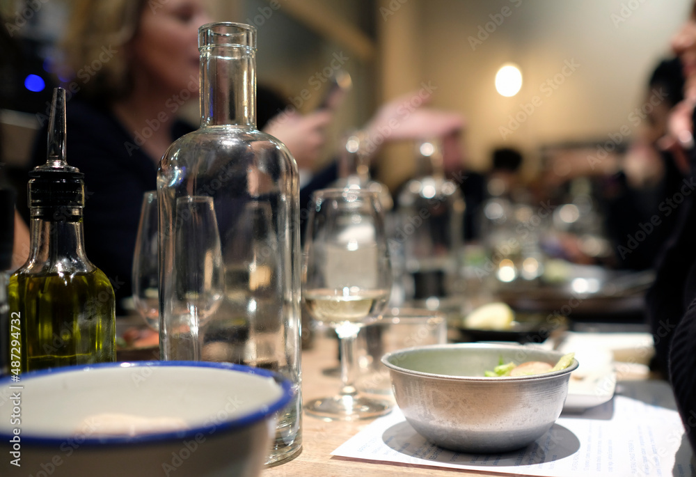 Group of blurred out people enjoying dinner in a restaurant Group of blurred out people enjoying dinner in a restaurant