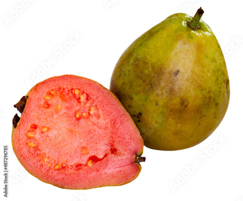 Fresh organic ripe red guavas fruit cut in half. Exotic fruits, healthy eating concept. Isolated over white background