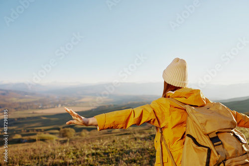 woman traveler admiring the landscape mountains nature Lifestyle