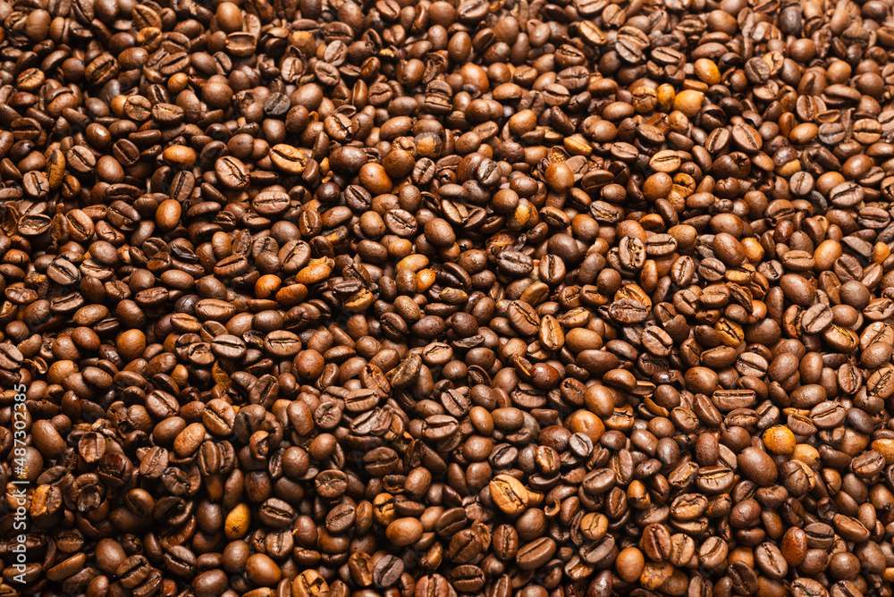 Coffee beans on a white background. Top view. Coffee beans on a white background. Top view.