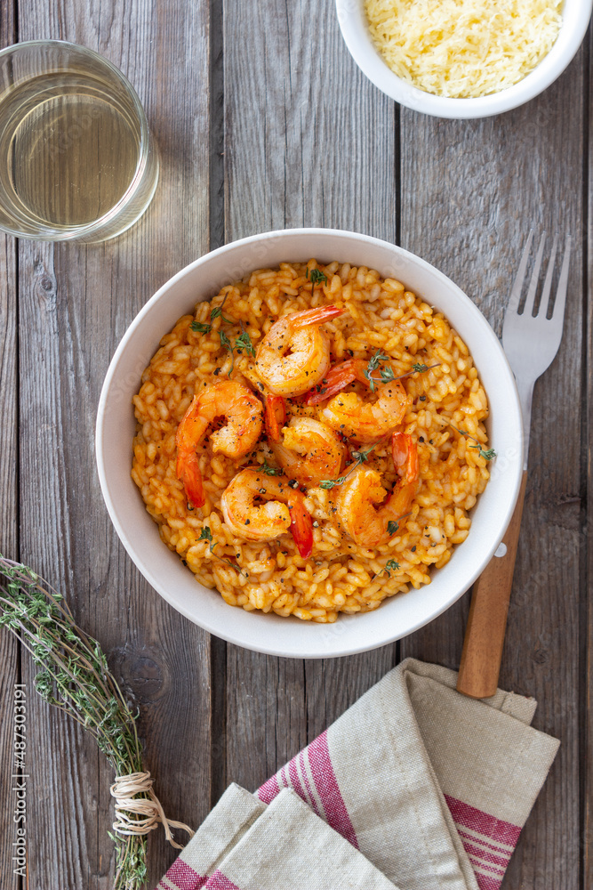 Risotto with shrimps, tomatoes and thyme. Italian food. Risotto with shrimps, tomatoes and thyme. Italian food.