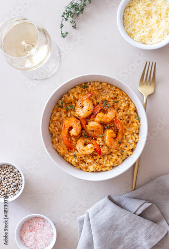 Risotto with shrimps  tomatoes and thyme. Italian food.