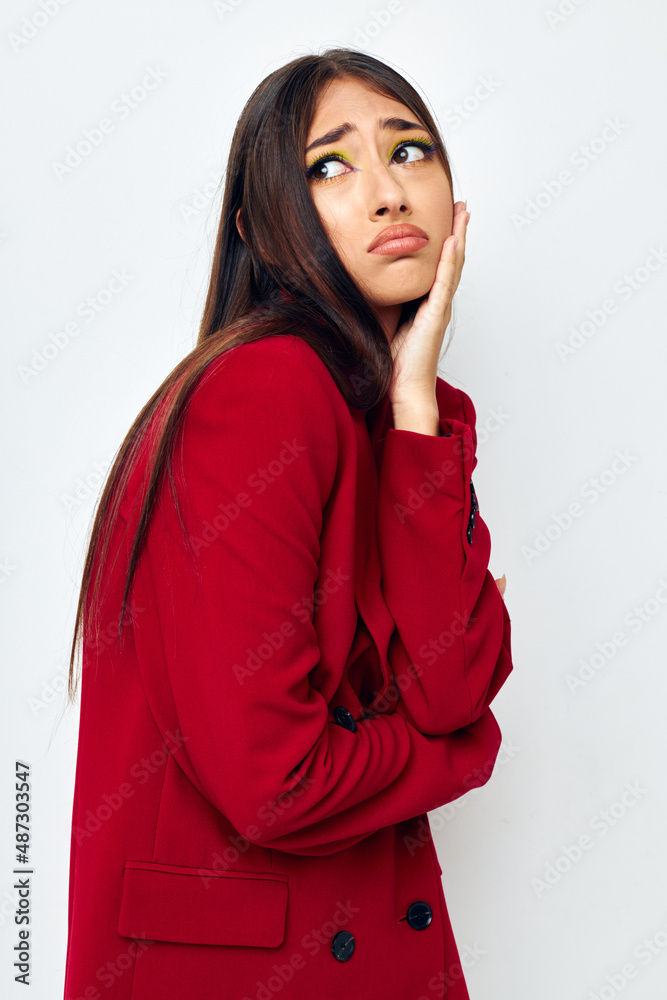 beautiful brunette in a red jacket cosmetics smile light background unaltered beautiful brunette in a red jacket cosmetics smile light background unaltered