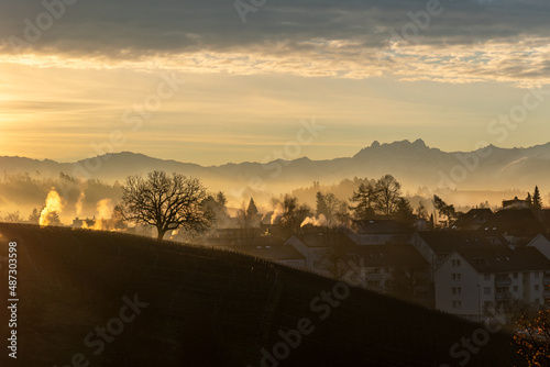 Obraz na płótnie Winter sunrise in the Zurcher Oberland region with the Alps in the background w salonie