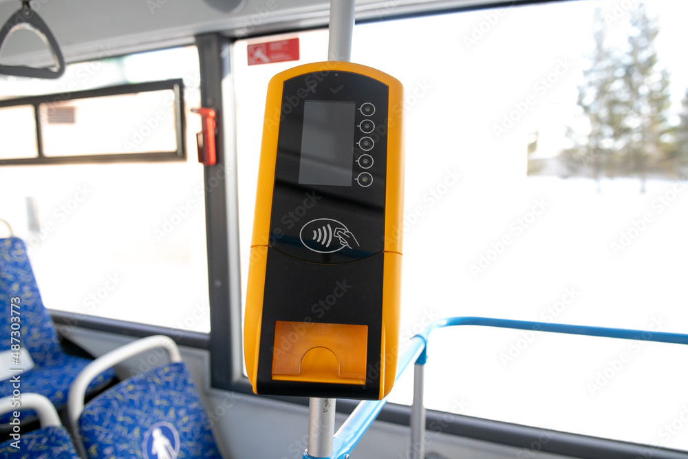 Payment terminal in the bus, non-cash payment for travel in public transport Payment terminal in the bus, non-cash payment for travel in public transport