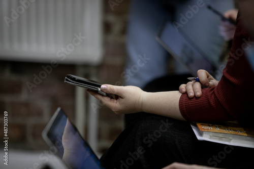 Close up of businessman using smartphone. Business concept