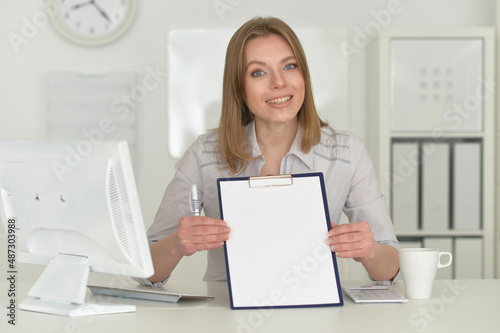  young business woman with flip board in office