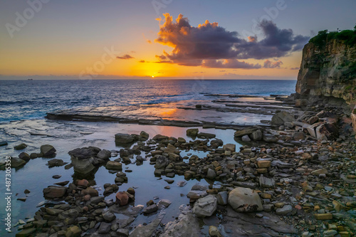 Aerial Sunrise Seascape at Rocky Inlet with clouds