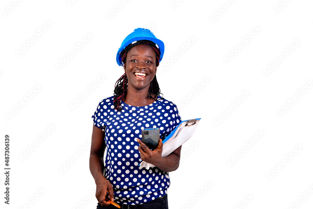 Fototapeta premium young female engineer holding mobile phone and clipboard smiling.