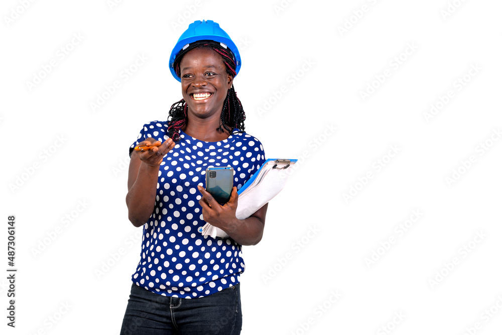 young female engineer holding mobile phone and clipboard smiling. young female engineer holding mobile phone and clipboard smiling.
