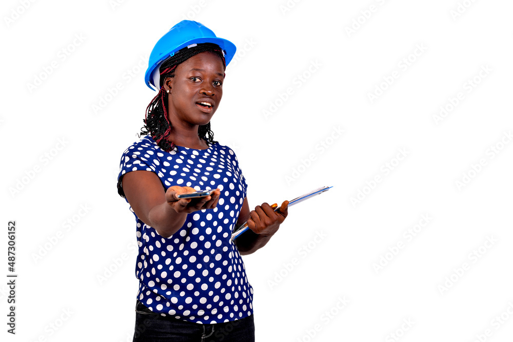young female engineer holding a clipboard and gives a mobile phone smiling. young female engineer holding a clipboard and gives a mobile phone smiling.