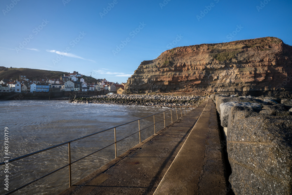Staithes seaside town and sea defenses in North Yorkshire