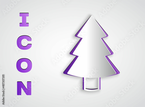 Paper cut Christmas tree icon isolated on grey background. Merry Christmas and Happy New Year. Paper art style. Vector