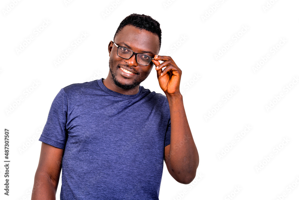 portrait of a young man adjusting glasses, smiling. portrait of a young man adjusting glasses, smiling.